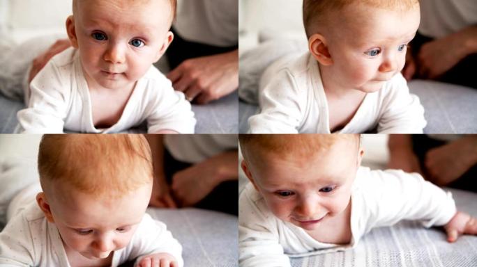 可爱的蓝眼睛宝宝试图爬行的特写镜头