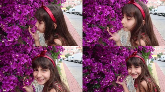 土耳其可爱的小女孩在花园里摆姿势