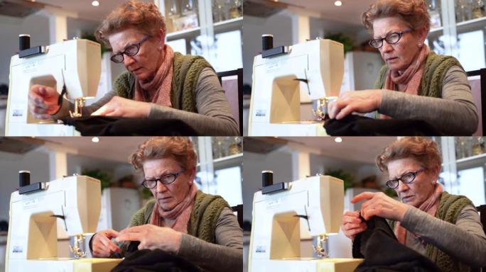在家使用缝纫机的女人。