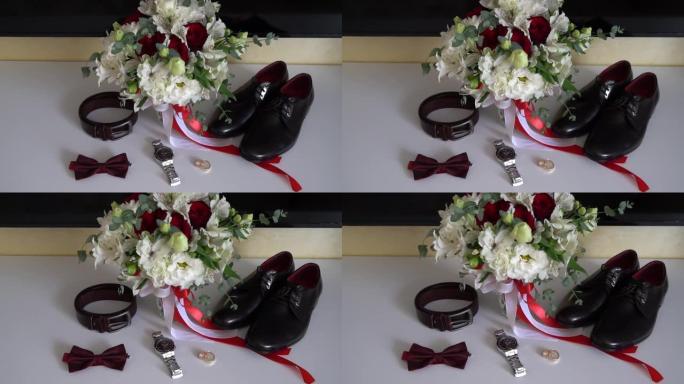 漂亮的男人结婚配饰。鞋子、戒指、花束、皮带和领带