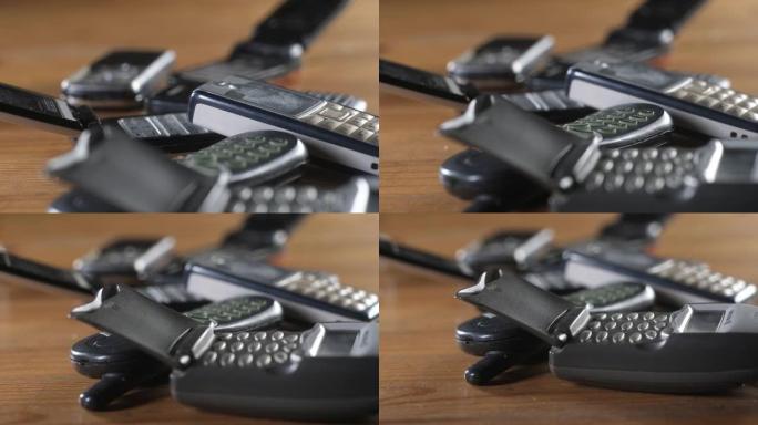 一堆旧手机键盘上的按钮特写。