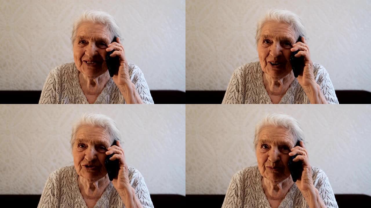 一个快乐的老妇人正在打电话，微笑着。