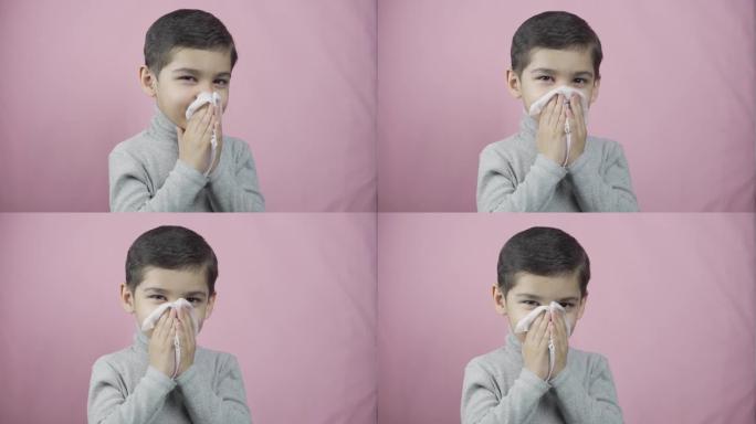 小男孩在吹鼻子。恶心咳嗽的孩子打喷嚏