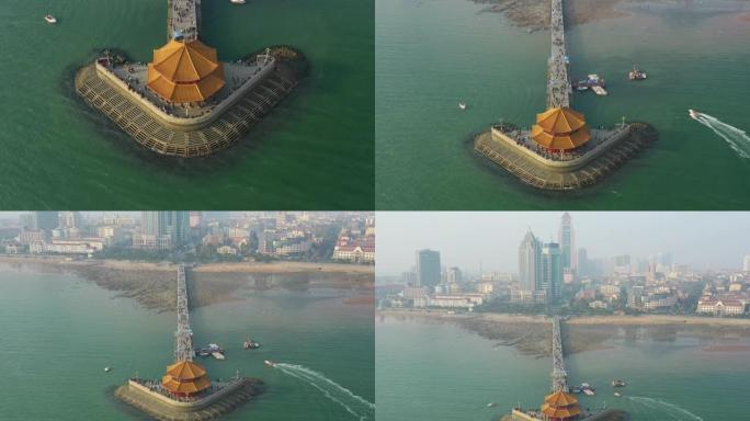 日落时间青岛市著名海滩海湾宝塔码头空中俯拍全景4k中国