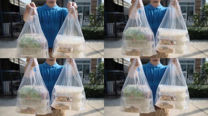 送货员把塑料袋从超市网上购物到女客户服务客户前台，快递杂货店冠状病毒covid19新的正常生活方式。
