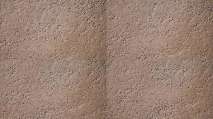 石头复古的垃圾深橙色背景墙，用于背景或带有文字装饰的地方。慢动作全高清视频素材