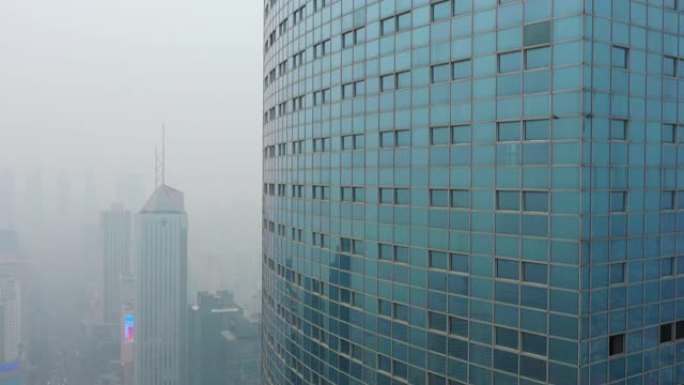 青岛市日间烟雾闹市区废弃摩天大楼空中全景4k中国
