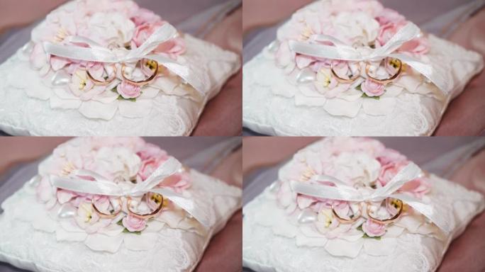 小枕头上的金色结婚戒指