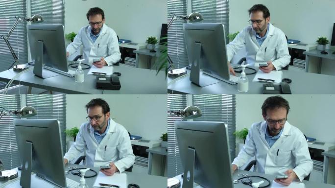 成熟的男性医生在电脑桌的医疗办公室与听诊器对抗covid19和冠状病毒