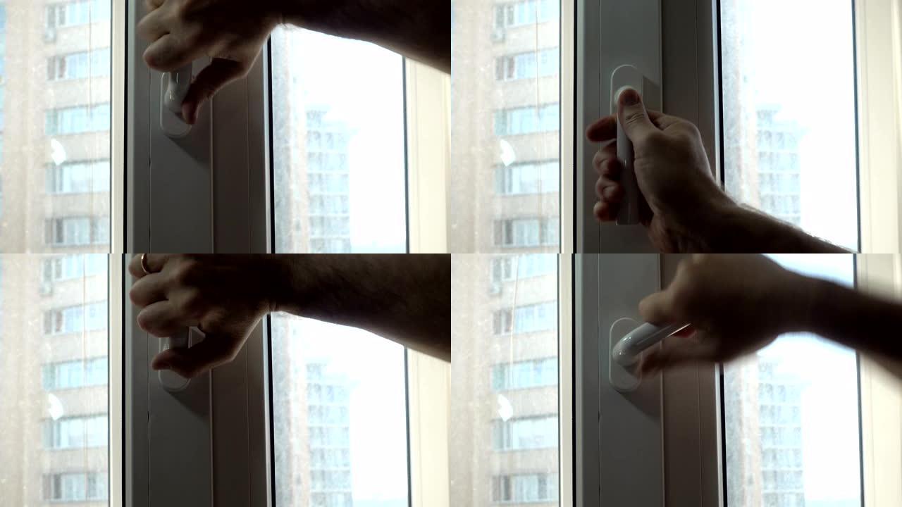 手的4k视图旋转窗户的手柄。