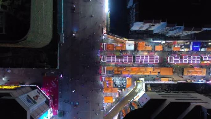 青岛市夜间照明著名步行街十字路口空中俯拍全景4k中国