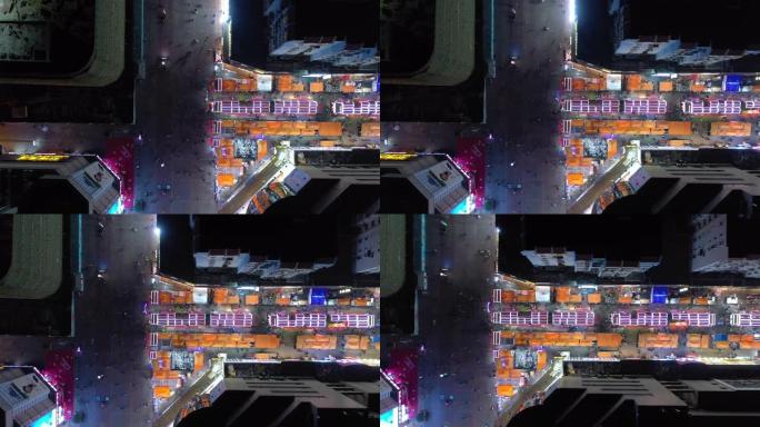 青岛市夜间照明著名步行街十字路口空中俯拍全景4k中国