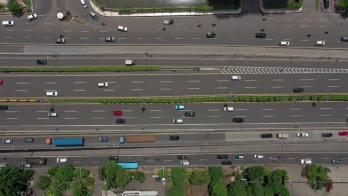 雅加达市中心阳光明媚的白天城市交通街空中俯拍全景4k印度尼西亚