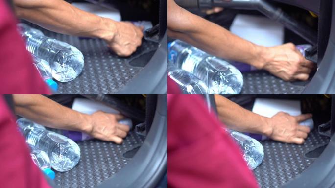 清洁汽车，用手关闭汽车真空吸尘器清洁汽车内部。