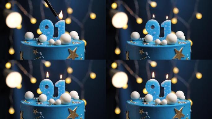 生日蛋糕编号91星星天空和月亮概念，蓝色蜡烛被打火机点燃，然后吹灭。如果需要，请在屏幕右侧复制空间。