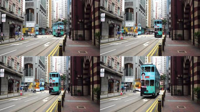 香港上环西市文物历史建筑外，两辆电车缓慢转弯
