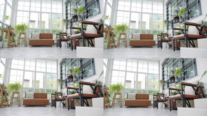 场景多莉拍摄室内现代住宅与小花园，在温室小花园放松