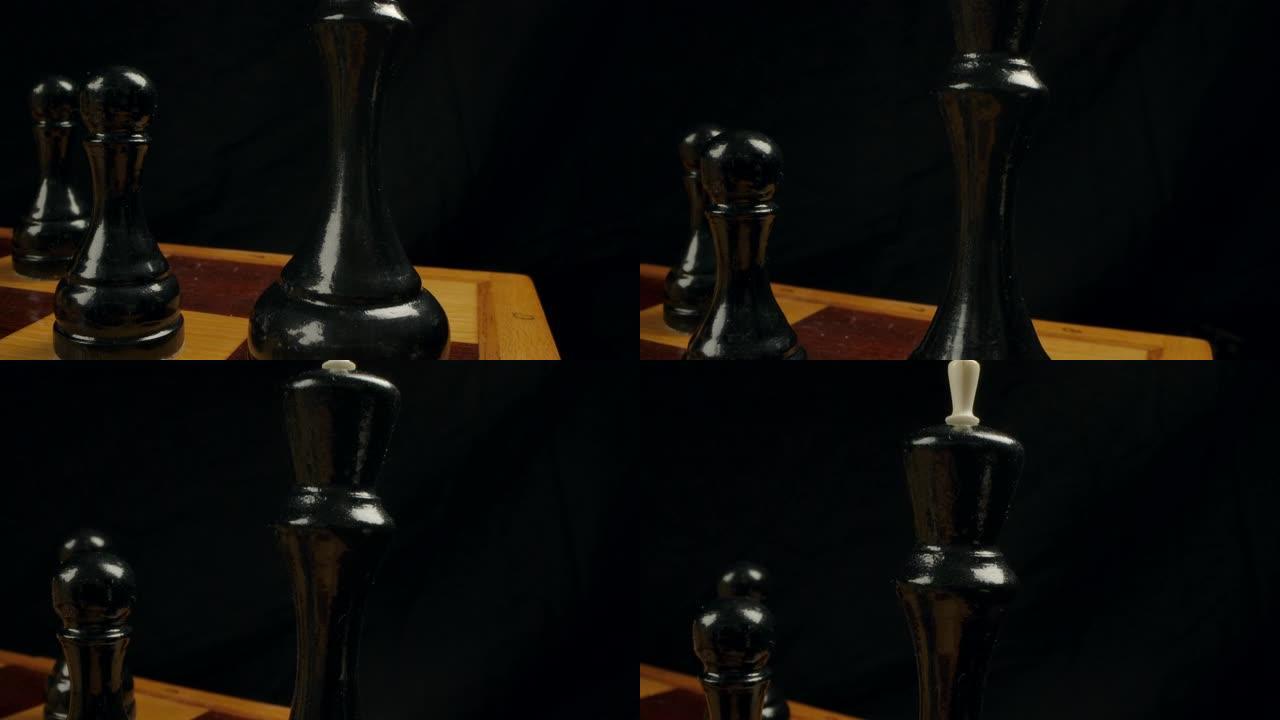 棋盘上黑色木制棋王的特写多莉微距镜头