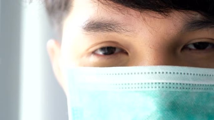 年轻的亚洲医生在诊所戴上防护口罩。概念健康与安全，N1H1冠状病毒检疫，病毒保护 .. 摘下口罩。