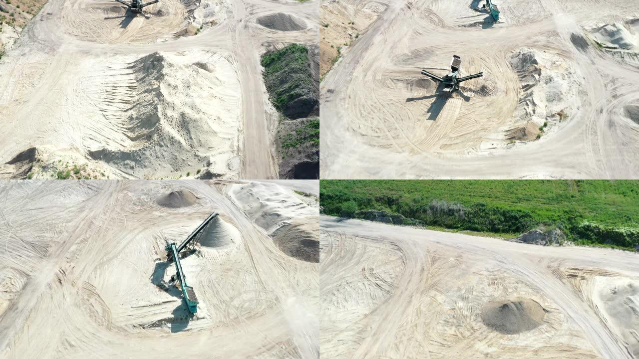 在德国北部的砾石坑和加工机器上经过筛选的沙堆飞行的航拍照片。