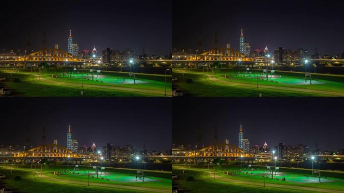 夜间照明台北市河边运动场市中心全景4k延时台湾