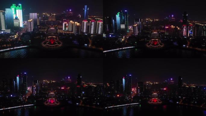 夜间照明青岛市著名奥林匹克湾广场纪念碑空中全景4k中国
