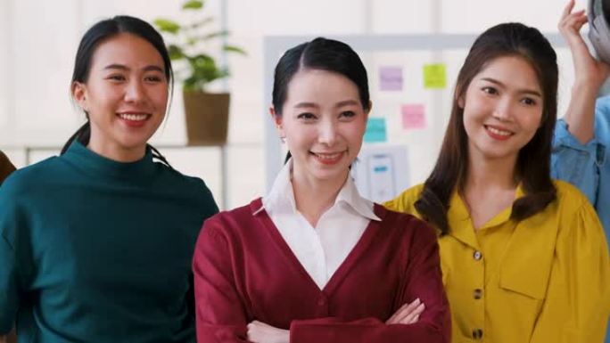 亚洲ux开发人员和ui设计师的肖像在现代办公室交叉并充满信心地微笑。创意数字开发机构。女性领导