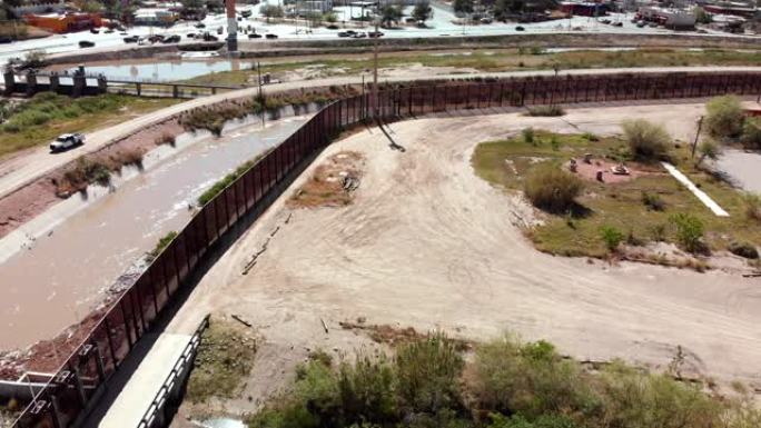 美国德克萨斯州埃尔帕索市和墨西哥华雷斯市边境墙的无人机全景图