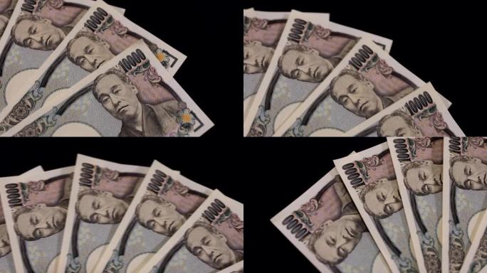 黑色背景上的日本货币100,000日元