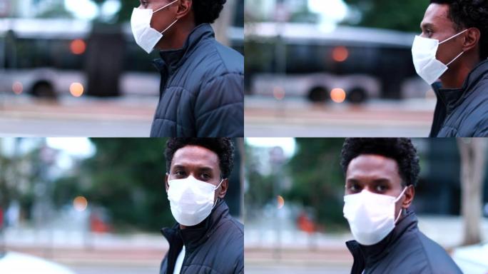非洲人在市中心散步时戴口罩预防