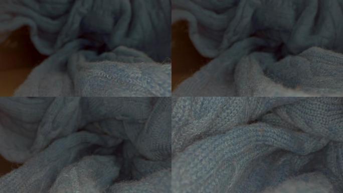 特写蓝色毛衣的宏观视图。单独棉针织的视图。