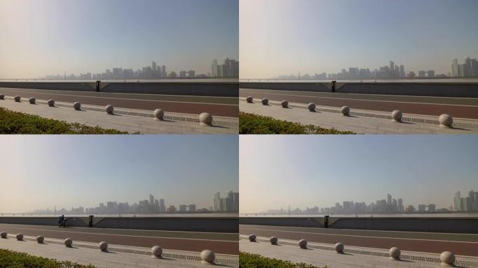 阳光明媚的日子杭州市河滨公园市中心海湾延时全景4k中国