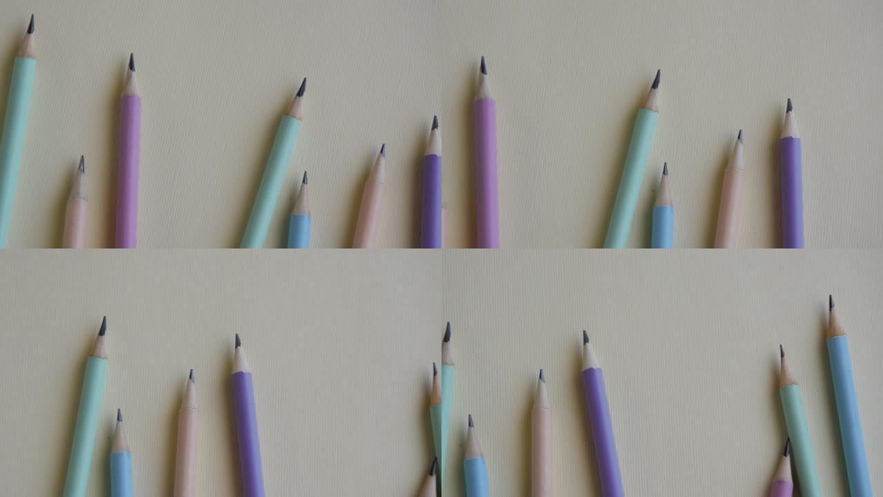 空床单上的柔和彩色铅笔，蓝色和粉红色
