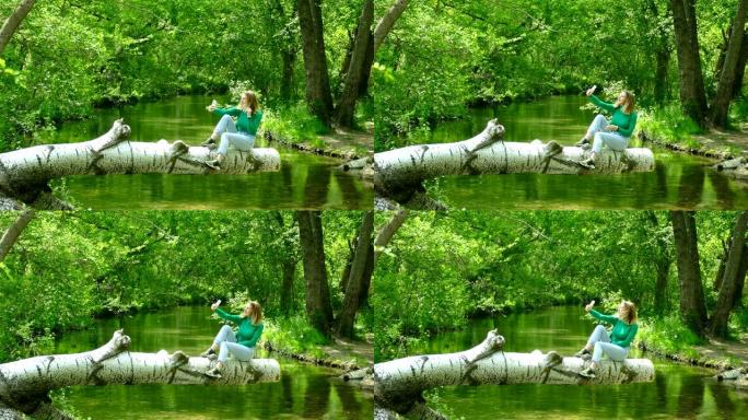 年轻女子在森林河上被拍照