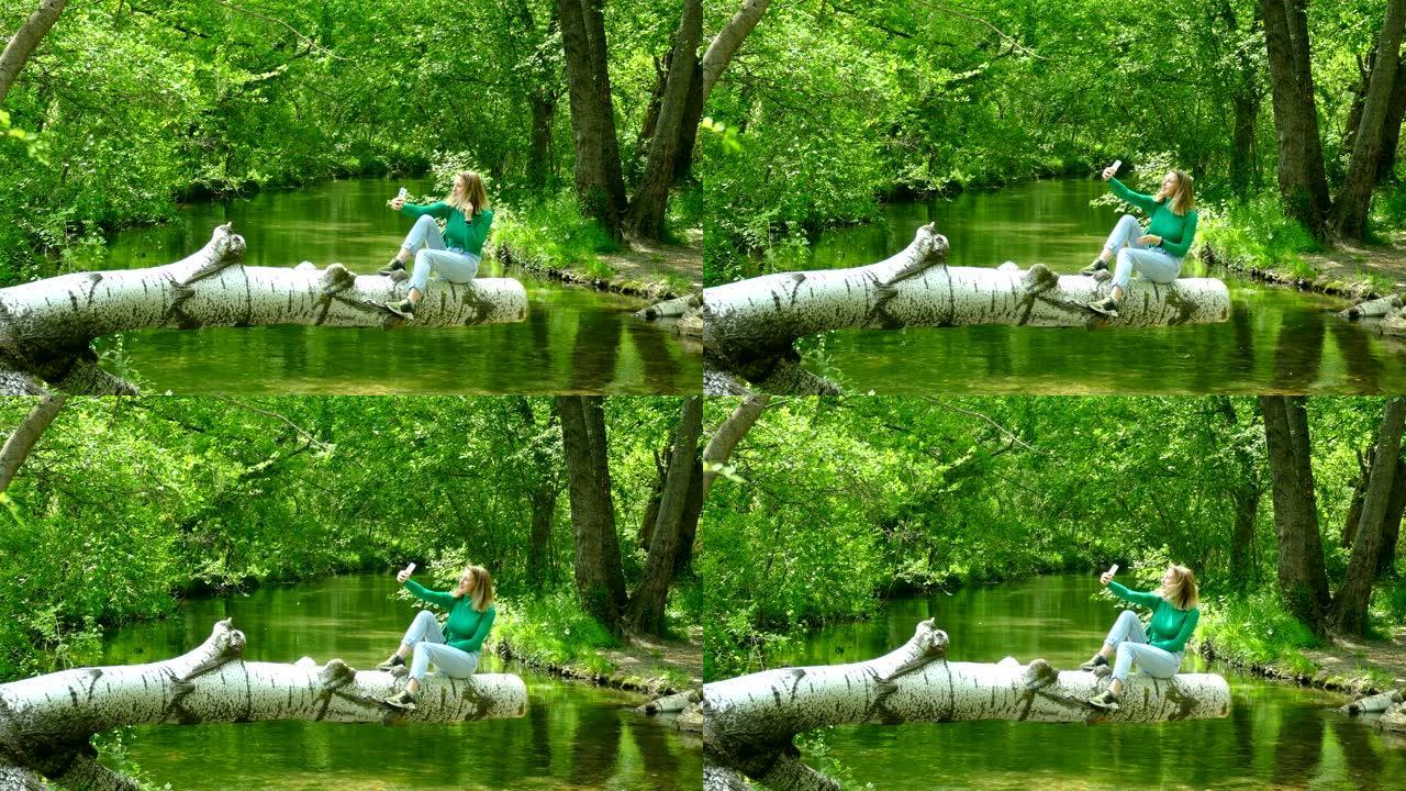 年轻女子在森林河上被拍照