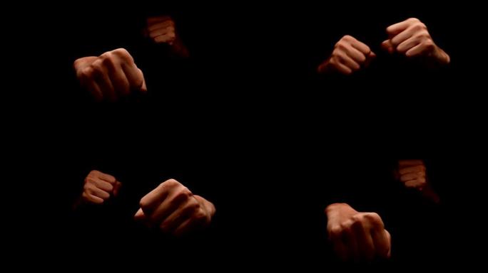 男性双手在黑色背景上显示出孤立的手势