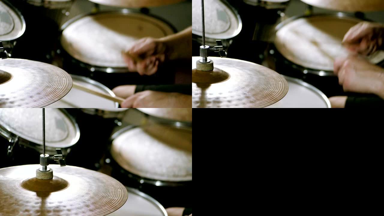 鼓手用棍棒击鼓的特写镜头。慢动作。高清