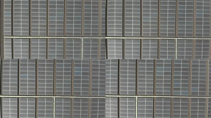 太阳能发电厂的鸟瞰图。太阳能电池板吸收阳光发电。屋顶上的太阳能电站可再生能源
