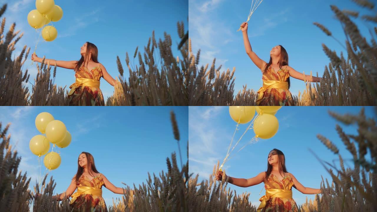 年轻女孩带着黄色气球在麦田里散步