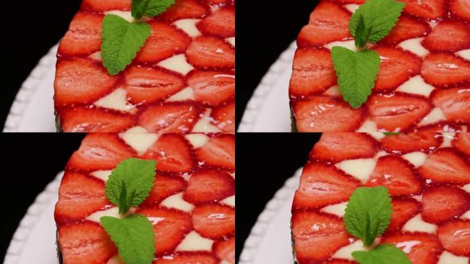 惊人美丽的手工装饰自制草莓蛋糕旋转。美味、新鲜、开胃的甜点特写，配薄荷小枝。糖果艺术，食品概念中的完