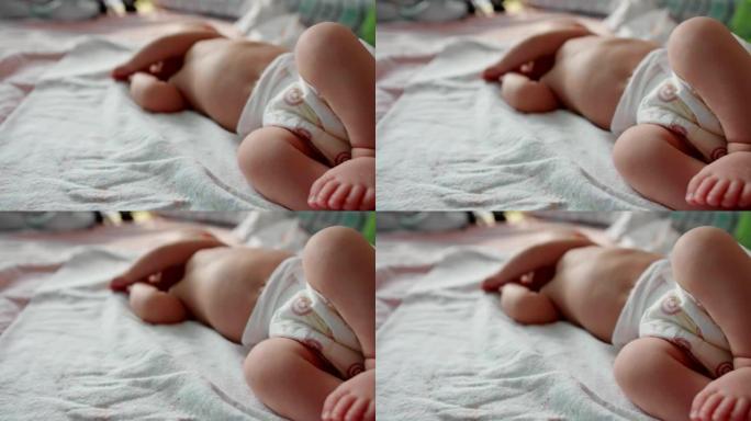 刚出生的婴儿正在床上睡觉。特写镜头。