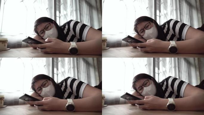 女人在新型冠状病毒肺炎病毒检疫上网时感到无聊。