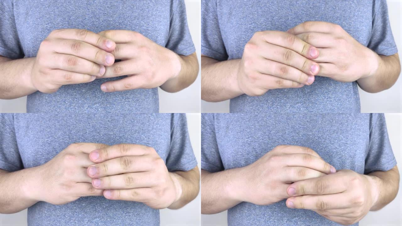 手指关节疼痛。一个人摩擦手指，手指受伤并拉扯。关节关节炎及其治疗。