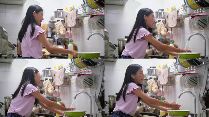 亚洲女孩在家洗碗，生活理念。