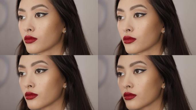 化妆师为亚洲女性完成化妆
