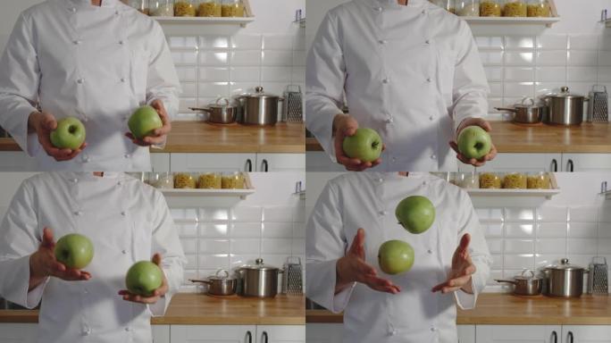 慢动作: 炊具在厨房里摆弄青苹果