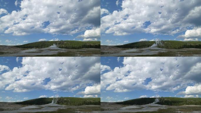怀俄明州黄石国家公园喷发的最后几分钟，天空和古老的忠实间歇泉释放蒸汽和水的壮丽景色