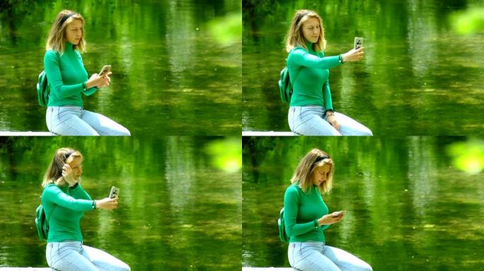 美丽的年轻女子在森林河上的智能手机上拍照