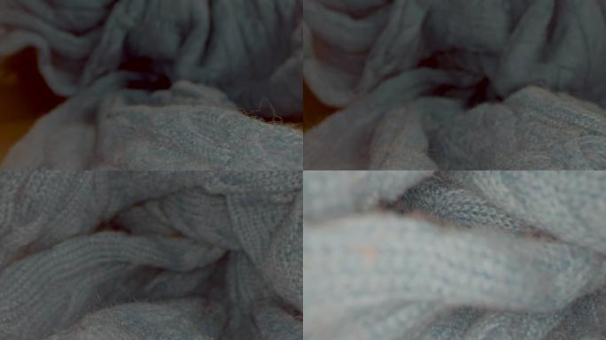特写蓝色毛衣的宏观视图。单独棉针织的视图。