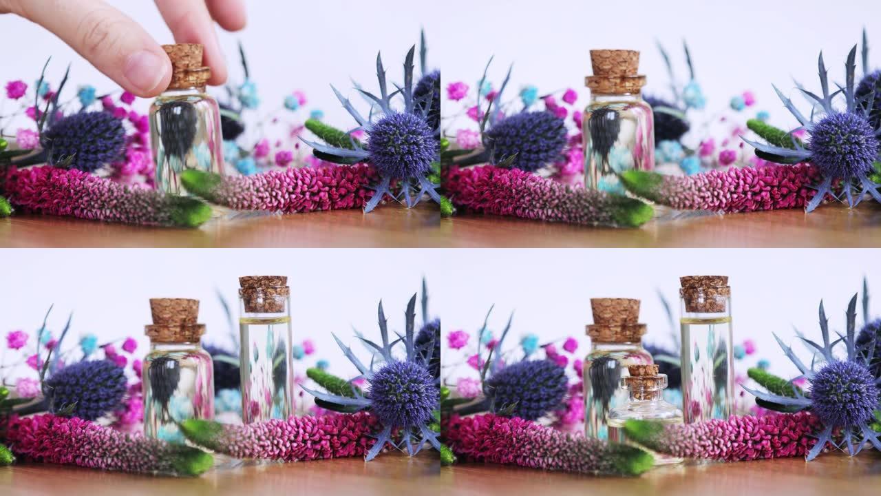 调香师创造新的芳香液体香水把精油放在桌子上。